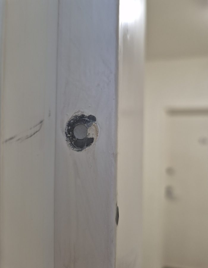Repaired holes in fire doors and frames to restore integrity and ensure compliance with fire safety requirements.
