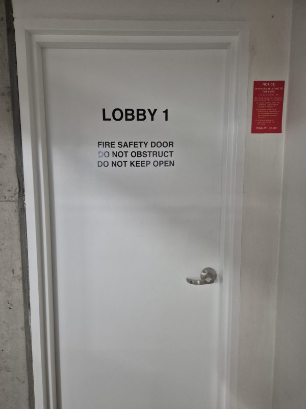Painting and stickers to common area fire doors