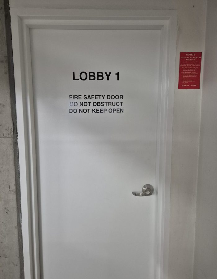 Painting and stickers to common area fire doors